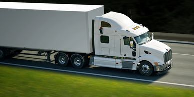 truck hauling dry freight such as food and beverages, pet food, groceries, cleaning supplies, lumber