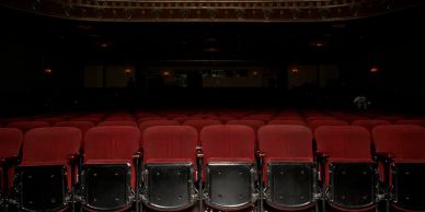 Empty theater with red seats.