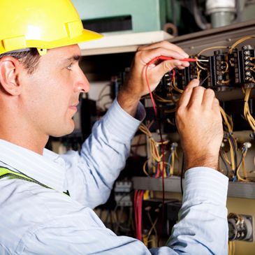 Decorative image showing electrician at work.