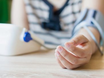 Person checking blood pressure at home.