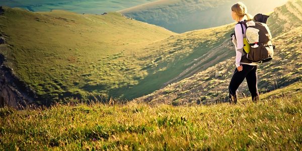 Hiker standing and enjoying the view on a mountain.