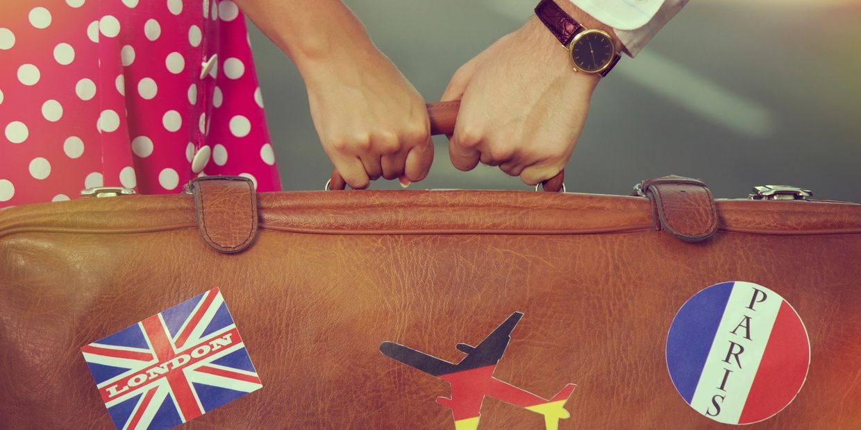 Couple holding a suitcase