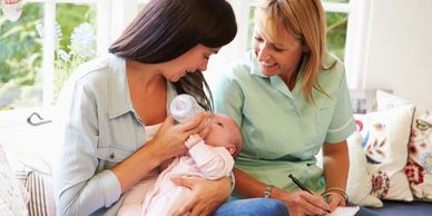 Beewise Doula giving postpartum care to Mom & Baby. Good birth doula support makes a positive birth