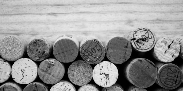 Close-up of wine corks arranged in rows, showing various textures and markings.