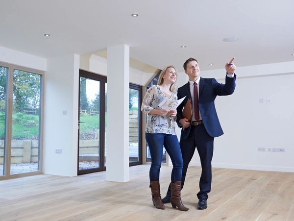 two people analyzing a new house.