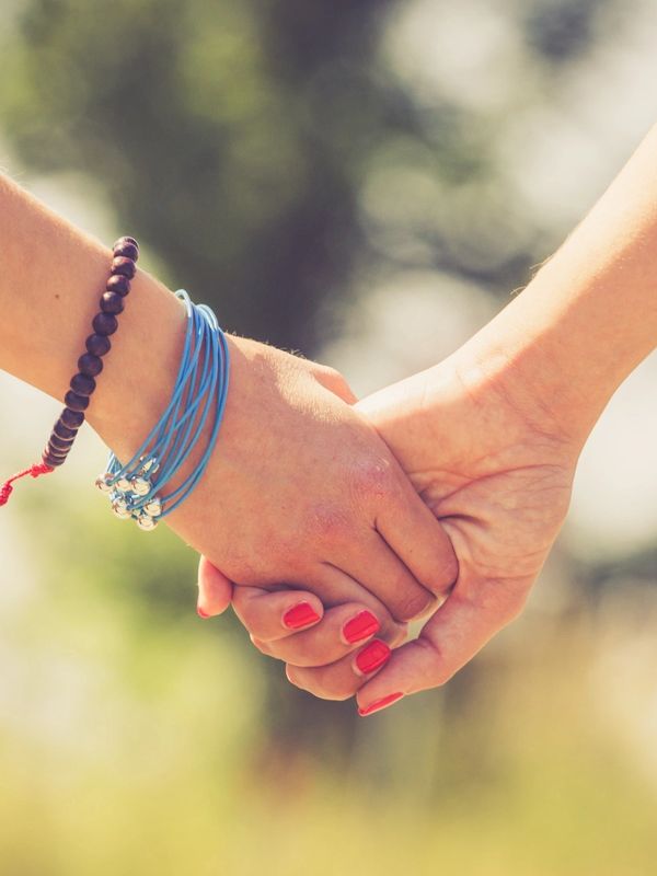 picture of mother and daughter holding hands