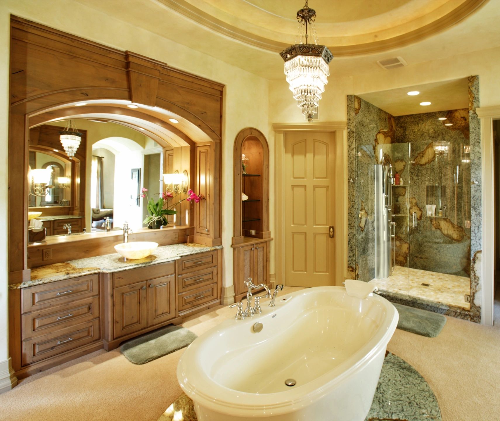 New bathroom vanity, stand-alone tub, custom tiled shower and chandelier 