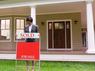 The "Sold ' sign proudly signifies the seamless transition of this welcoming abode into the hands of