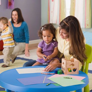 Children learning with their teachers at daycare