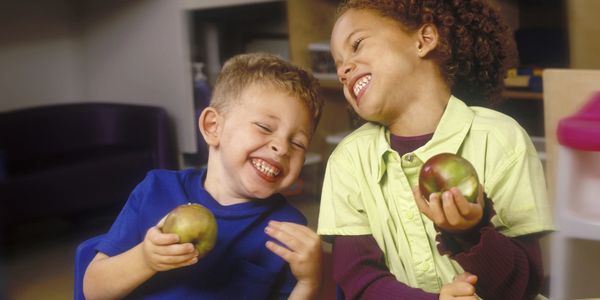 Children enjoying lunch at day care