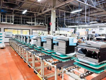 Assembly line with office printers in a factory.