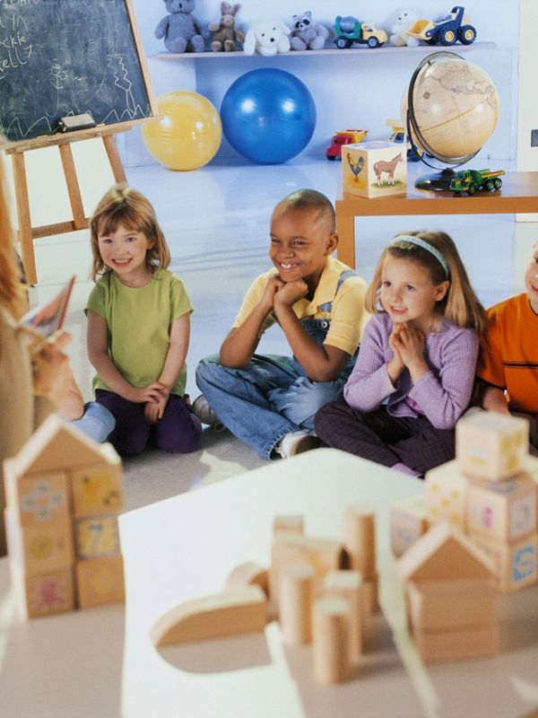 Children learning with teacher at daycare