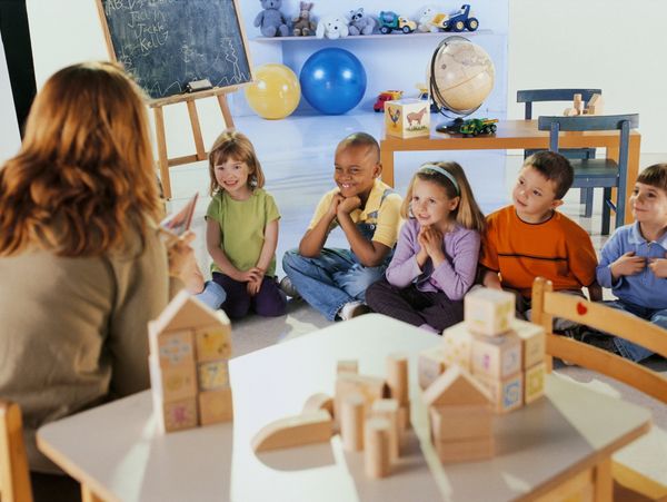 children and teacher at day care