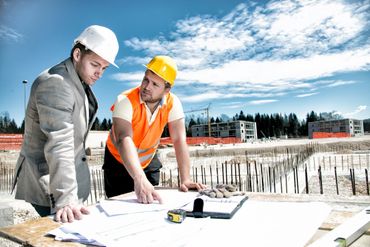 Two construction personnel in the site project