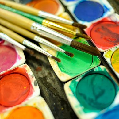 Close-up of watercolor paints and brushes.