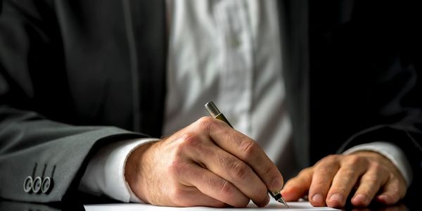 Attorney signing document.