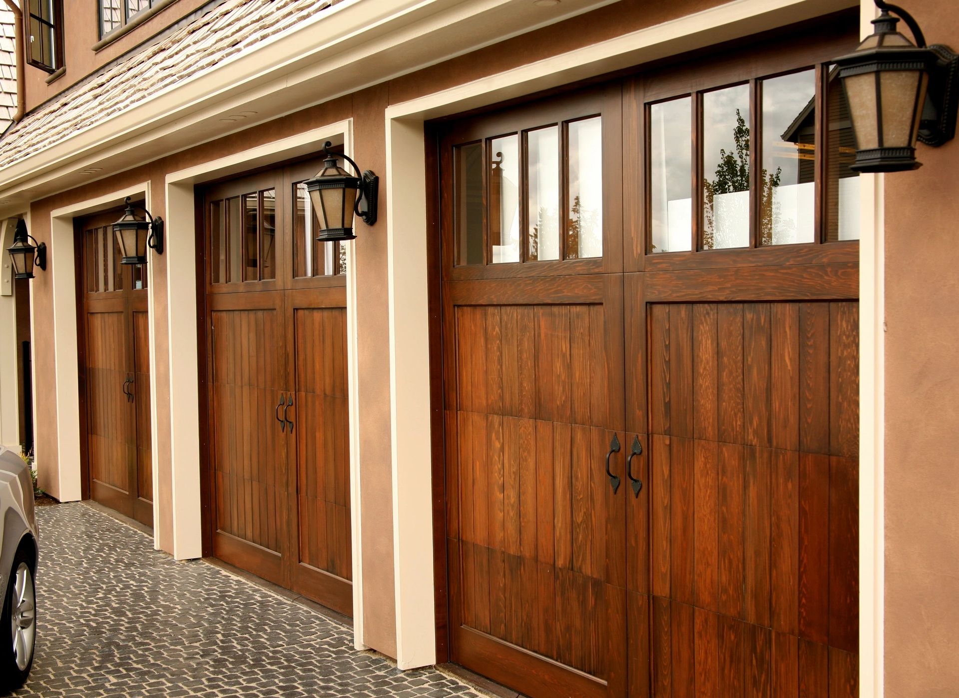 Garage doors showing exterior lighting