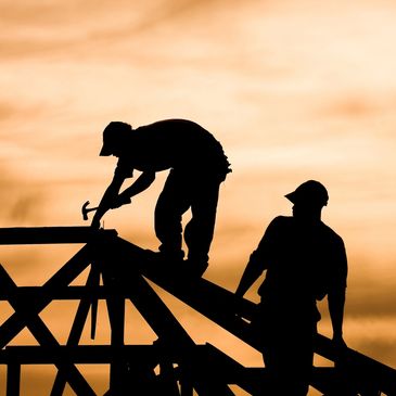 Carpenters Framing a Roof that was Engineered and Designed by BG Custom homes 