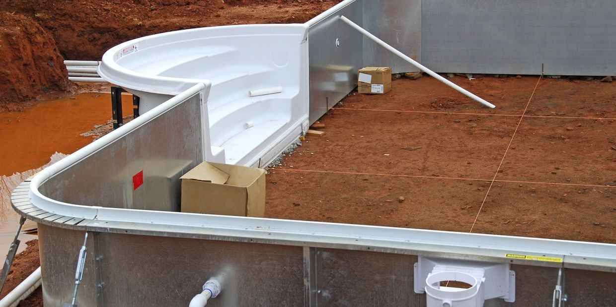 Expert pool builders finishing a modern backyard in Hobbs, NM.