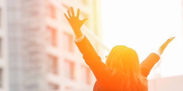 A woman enjoying the energy produced by the sun