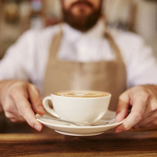 Man passing a coffee