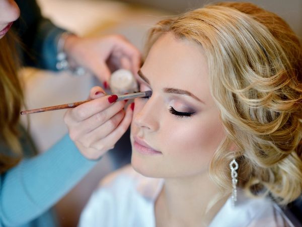 Bride getting makeup done