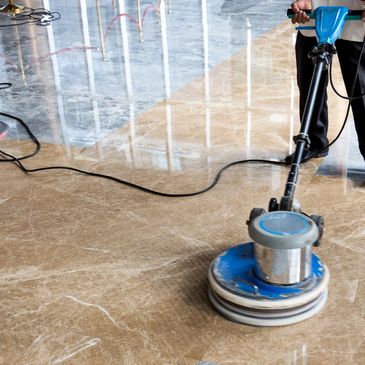 Worker buffing tile floor