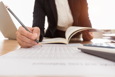 An internal auditor at work, examining the Council's financial and governance records.