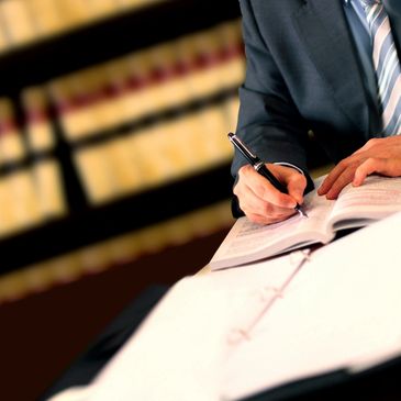 Attorney drafting contracts, wills, trusts