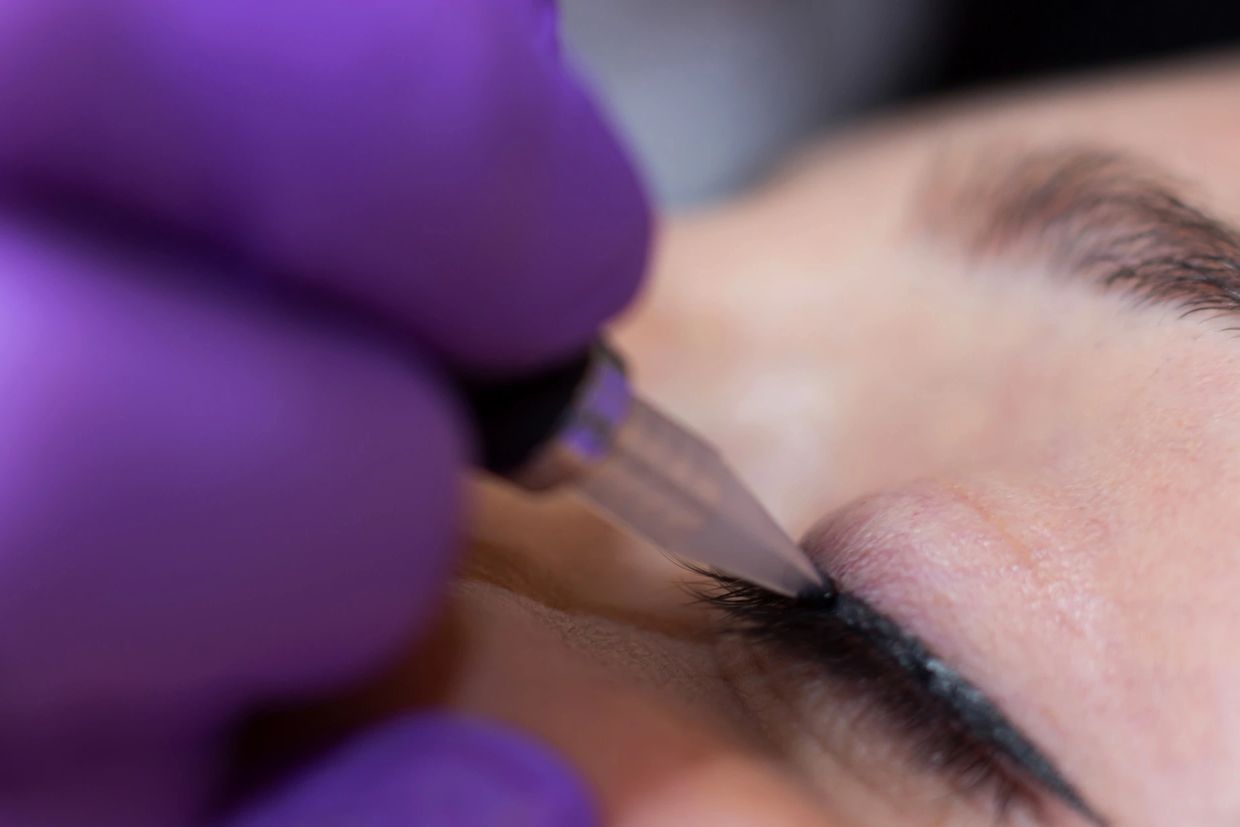 Close-up of permanent eyeliner tattoo on eyelid.