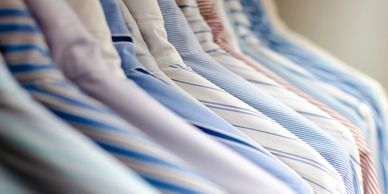 A row of laundered dress shirts.
