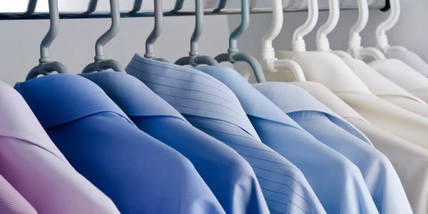 hanging dry-cleaned shirts. Easy Breezy Laundromat. Laundromat near me, Coin laundry near San Diego,