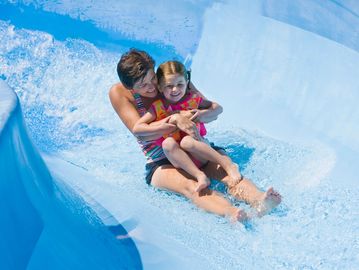 mother and daughter on a water park slide