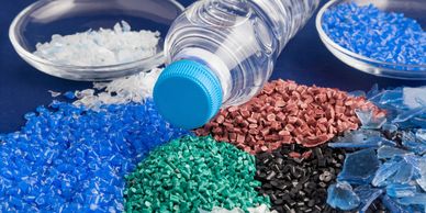 Molded plastic bottle and colored plastic pellets