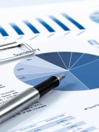 Clipboard with paperwork showcasing financial projections.