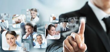 Businessman selecting virtual profiles of professional individuals.