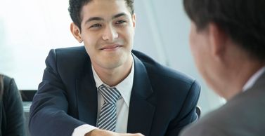 Young man in interview, businessmen, shaking hands