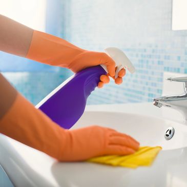 A carer cleaning the bathroom