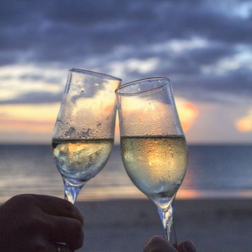 Wine on the beach at sunset