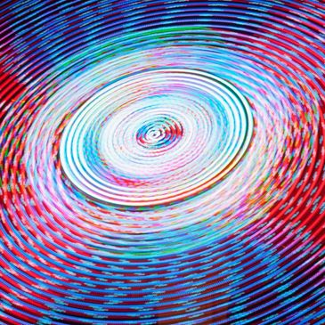 Colorful concentric circular patterns with a vibrant, psychedelic effect.