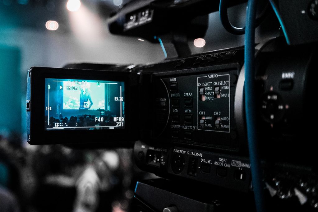 Close-up of a video camera screen capturing a live event.