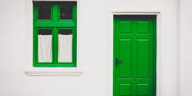 House with green door and window