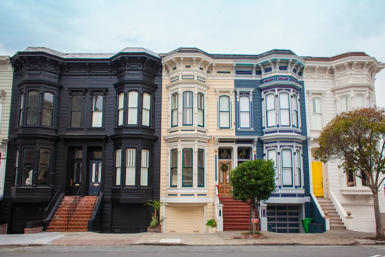 Four homes boast an attractive array of colors from their black, tan, blue and white exteriors.