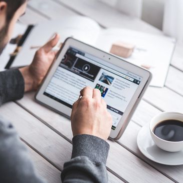 Photo of man working on tablet