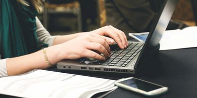 woman typing on a keyboard