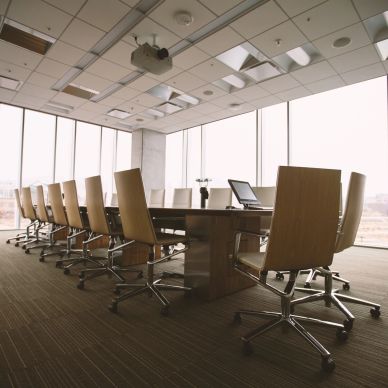 Modern conference room with chairs and a table.