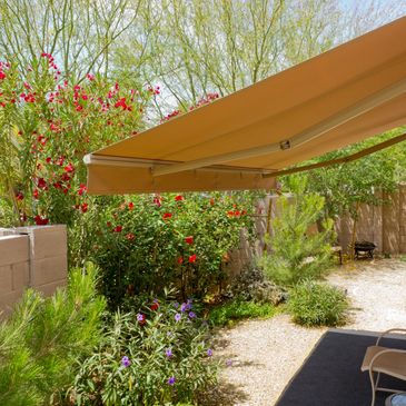 A Temporary Roof With a Chair Under the Roof Image