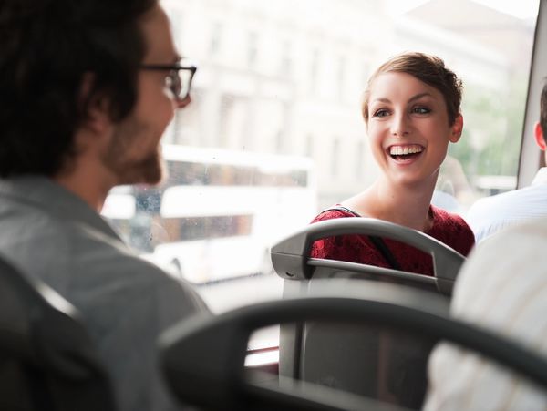 People happy in a interior of a bus