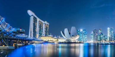 Night view of Singapore skyline with Marina Bay Sands and Helix Bridge.