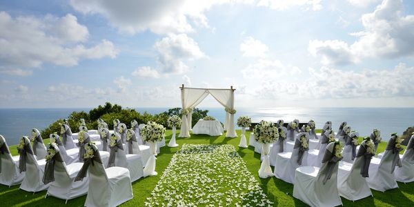 A beautiful Hudson Valley wedding ceremony site. White archway and table at altar set.  